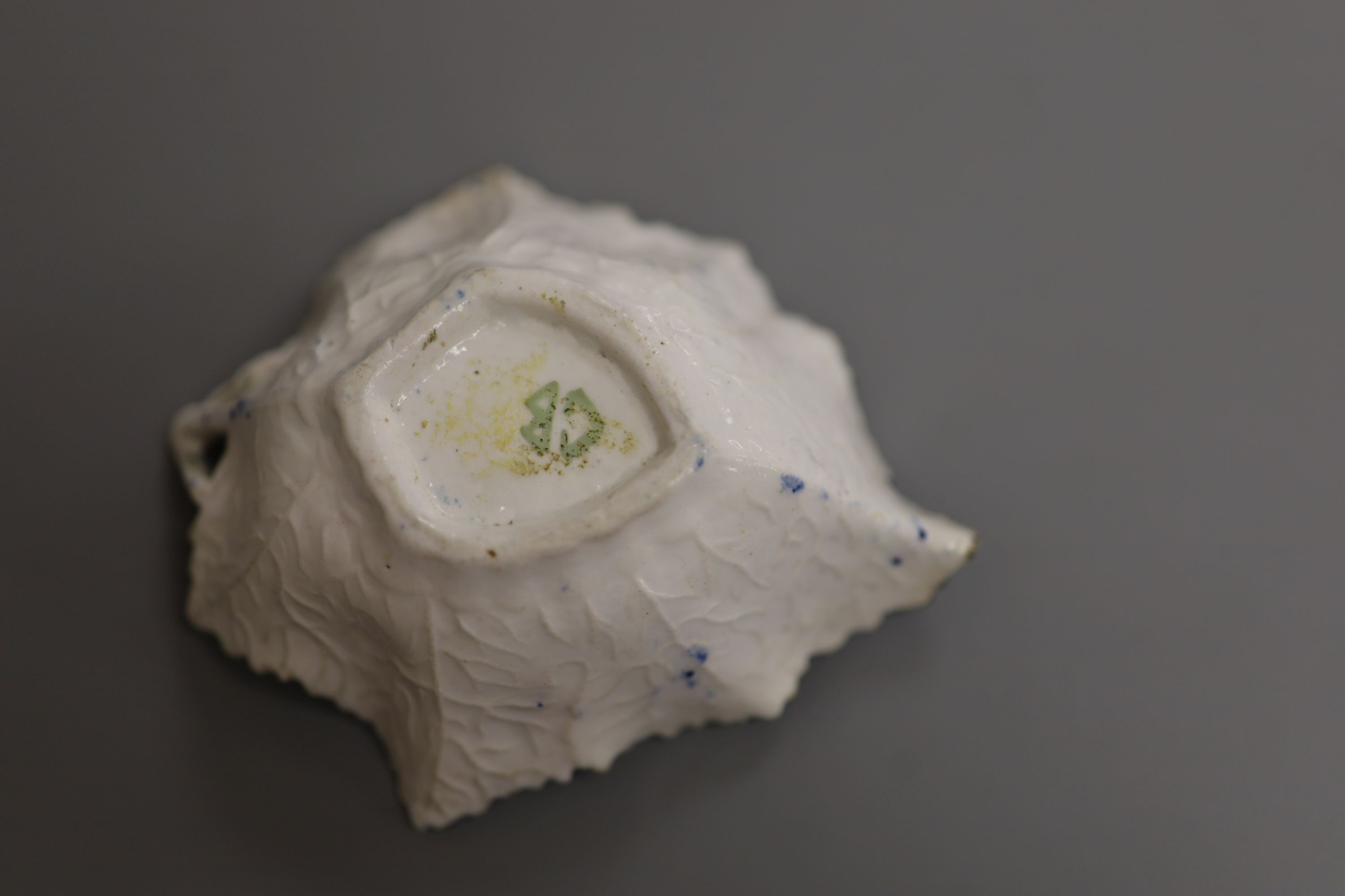 A Derby leaf shaped pickle dish printed with roses, under a painted border ex. Gilbert Bradley Col., green GB mark, length 9.5cm